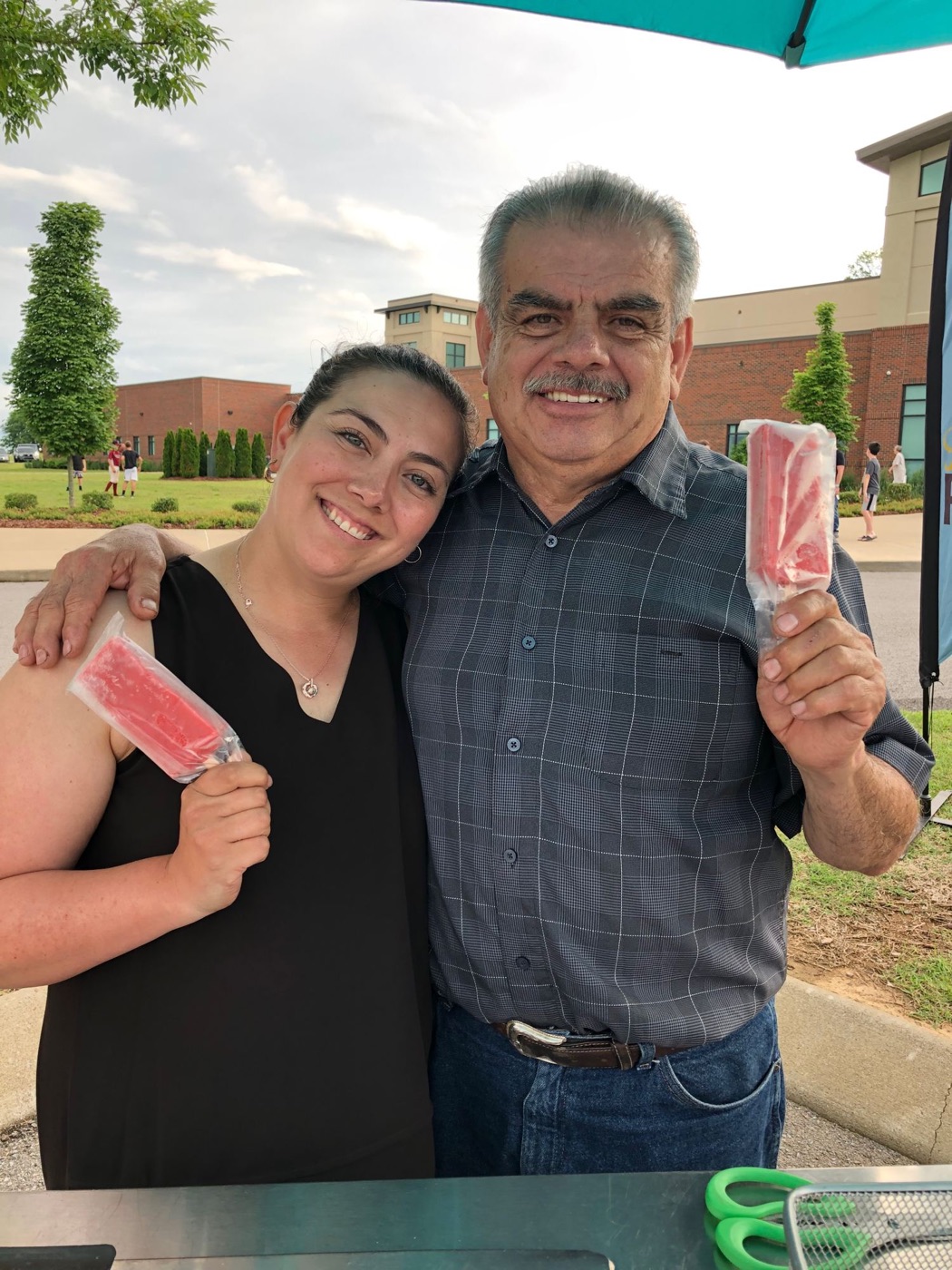 Lorena Cantu and her father Geronimo, each holding a paleta